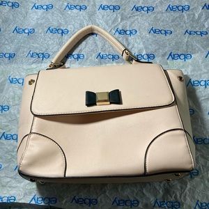 Cute little pale pink handbag with black bow